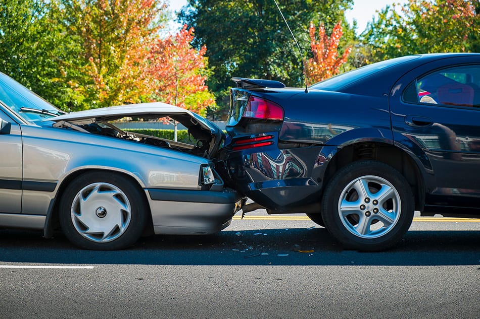 photo of two vehicles colliding in an accident in Alberta